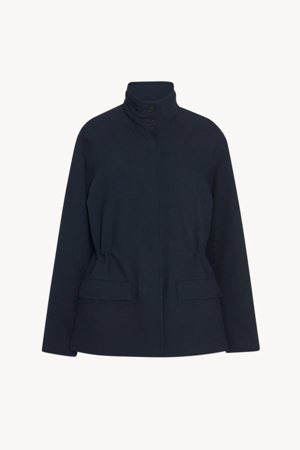 Front view of navy tanera jacket on white background, with no model shown.