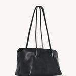 Front slanted view of black terrasse bag on white background, with no model shown.