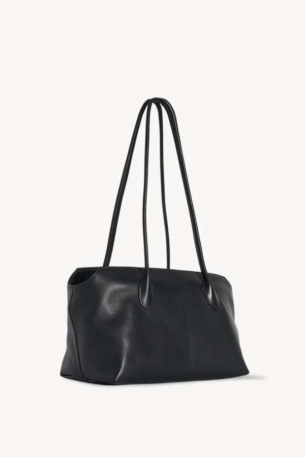 Front slanted view of black terrasse bag on white background, with no model shown.