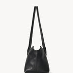 Side view of black terrasse bag on white background, with no model shown.