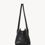 Side view of black terrasse bag on white background, with no model shown.