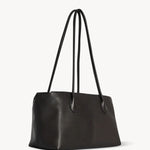 Front slanted view of dark brown terrasse bag on white background, with no model shown.
