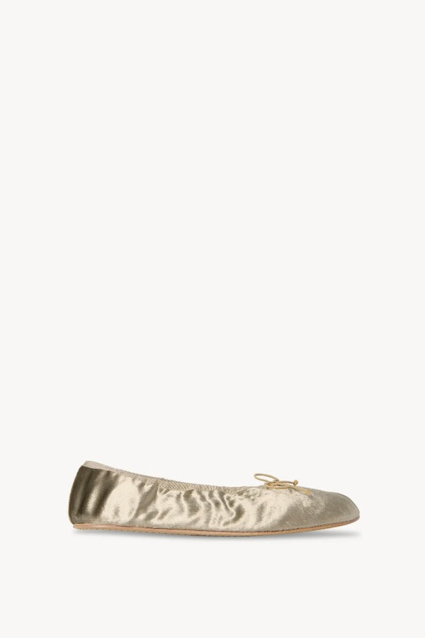 Right side view of taupe round ballet flat on white background, with no model shown.