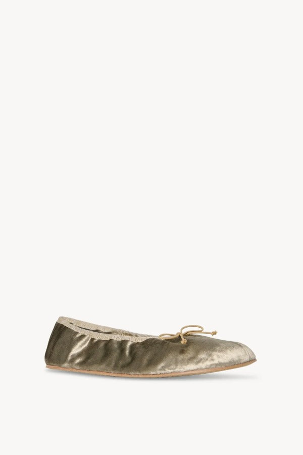 Right side slanted view of taupe round ballet flat on white background, with no model shown.