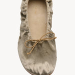 Overhead view of taupe round ballet flat on white background, with no model shown.