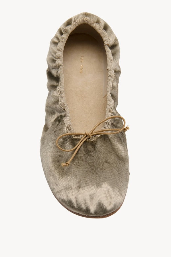 Overhead view of taupe round ballet flat on white background, with no model shown.