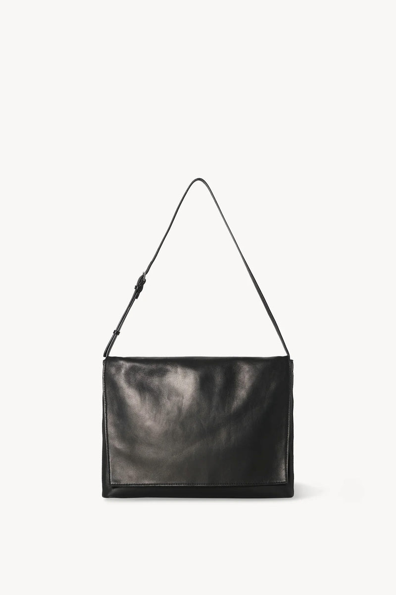 Front view of black leather bag on white background, with no model shown.