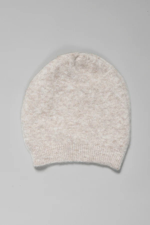 Folded view of camel knitted cap on grey background, with no model shown.