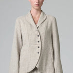 Front view of chalk herringbone jacket on model wearing chalk pants, against a grey background.