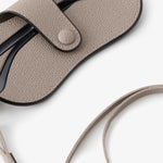 Back alternate view of nude glasses case with lanyard on white background, with no model shown.