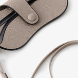 Back alternate view of nude glasses case with lanyard on white background, with no model shown.