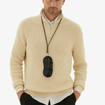 Back alternate view of black glasses case with lanyard on model wearing yellow sweater and black trousers, against a white background
