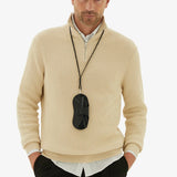 Back alternate view of black glasses case with lanyard on model wearing yellow sweater and black trousers, against a white background