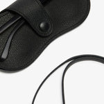 Back alternate view of black glasses case with lanyard on white background, with no model shown.