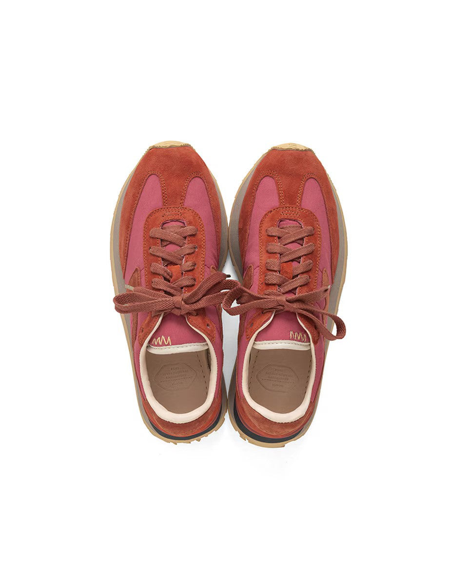 Overhead view of red fkt runner sneaker on white background, with no model shown.