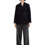 Front view of black sabrina db jacket on model wearing grey pants, against a white background.