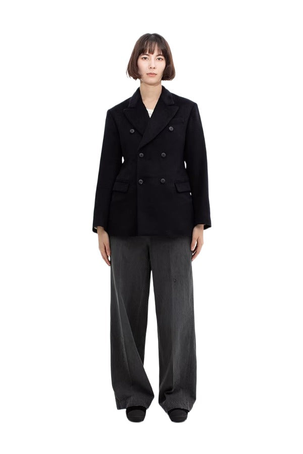 Front view of black sabrina db jacket on model wearing grey pants, against a white background.