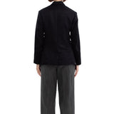 Back view of black sabrina db jacket on model wearing grey pants, against a white background.