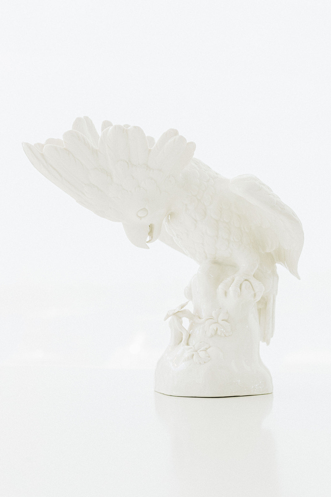 Pair of Small Nymphenburg Porcelain Cockatoos with Arched Wings Height: approx 8”