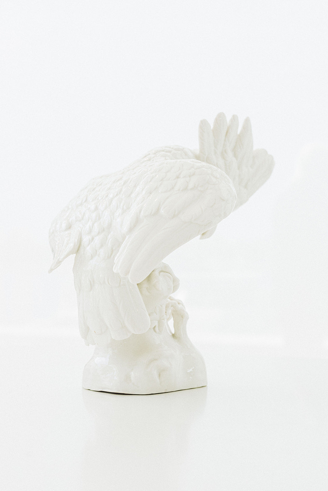 Pair of Small Nymphenburg Porcelain Cockatoos with Arched Wings Height: approx 8”