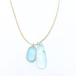 Pippa-Small-18K-yellow-gold-blue-topaz-collette-pendant-on-cord-amarees