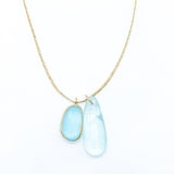 Pippa-Small-18K-yellow-gold-blue-topaz-collette-pendant-on-cord-amarees