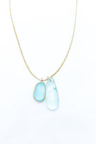 Pippa-Small-18K-yellow-gold-blue-topaz-collette-pendant-on-cord-amarees