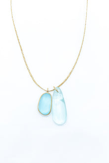 Pippa-Small-18K-yellow-gold-blue-topaz-collette-pendant-on-cord-amarees