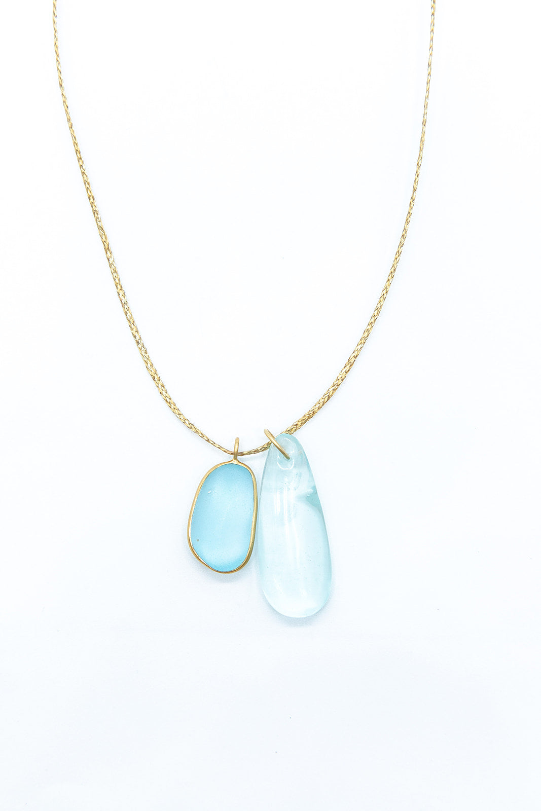 Pippa-Small-18K-yellow-gold-blue-topaz-collette-pendant-on-cord-amarees