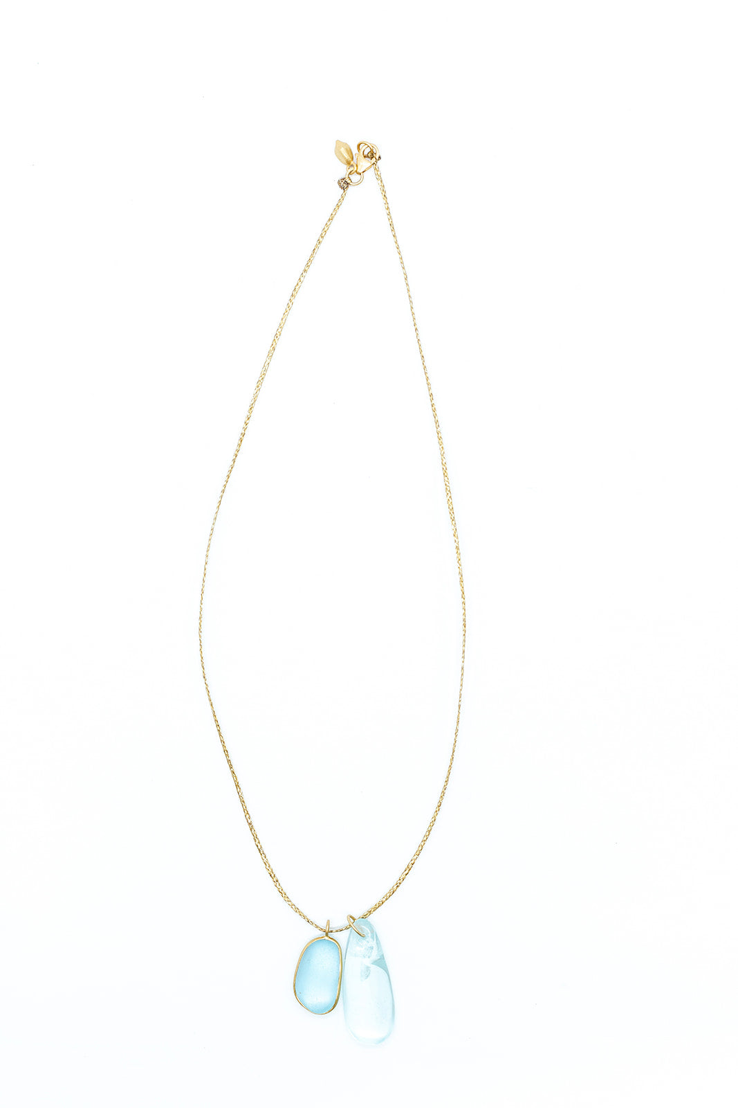 Pippa-Small-18K-yellow-gold-blue-topaz-collette-pendant-on-cord-amarees